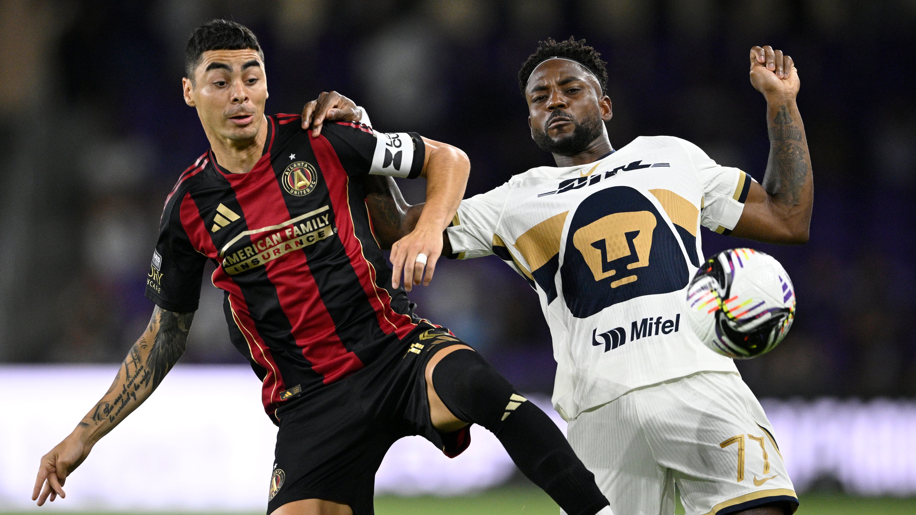 Atlanta's Miguel Almiron (left) and Puma UNAM's Alvaro Angulo compete for the ball during the first half of a Leagues Cup soccer match. Almiron started the season at right wing and has been moved back to that position. (Phelan M. Ebenhack/AP)