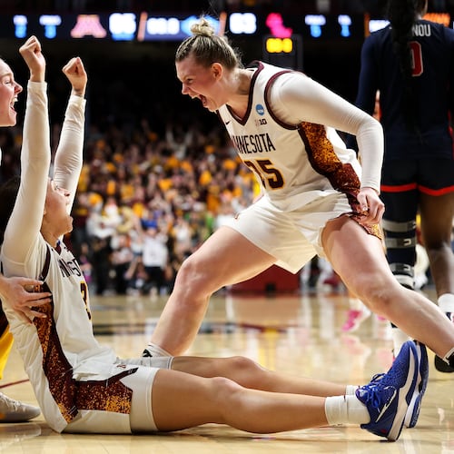 Minnesota guard Amaya Battle, center, celebrates after her winning basket against Mississippi during the second half in the second round of the NCAA college basketball tournament, Sunday, March 22, 2026, in Minneapolis. (AP Photo/Matt Krohn)