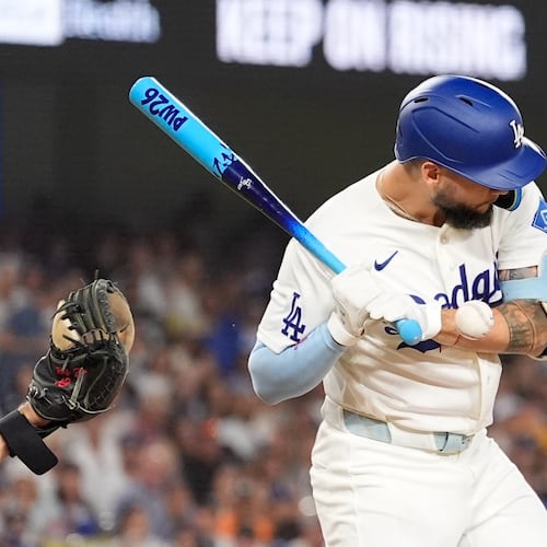 Los Angeles Dodgers' Andy Pages is hit in the hand by a pitch during the third inning of a baseball game against the Pittsburgh Pirates, Friday, Aug. 21, 2026, in Los Angeles. (AP Photo/Mark J. Terrill)