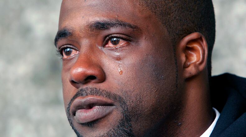 FILE - This May 24, 2012 file photo shows Brian Banks weeping after his rape conviction was dismissed in court, in Long Beach, Calif. Banks has signed with the Atlanta Falcons after the former Southern Cal recruit's football dream was derailed when he was convicted of rape and kidnapping charges a decade ago. (AP Photo/Nick Ut, File)