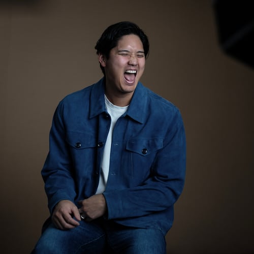 Los Angeles Dodgers' Shohei Ohtani shares a laugh with his translator during an interview with The Associated Press in Pasadena, Calif., Wednesday, Nov. 26, 2025. (AP Photo/Jae C. Hong)