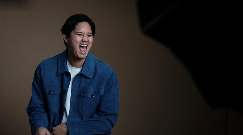 Los Angeles Dodgers' Shohei Ohtani shares a laugh with his translator during an interview with The Associated Press in Pasadena, Calif., Wednesday, Nov. 26, 2025. (AP Photo/Jae C. Hong)