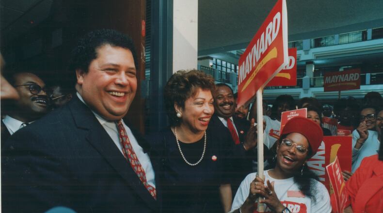 Maynard Jackson and his wife Valerie smile as they leave the registration room for qualifying for the mayoral race in Atlanta in 1989. Jackson initiated a plan to bring equal opportunity for city contract awards. (Johnny Crawford/AJC staff)
