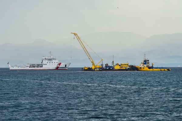 FILE - Italian Coast Guard's Luigi Dattilo patrol boat, left, assists the multi-purpose floating work barge Hebo Lift 2 monitoring the stretch of sea off Porticello, near Palermo, Sicily, Italy, Sunday, May 4, 2025, where the British superyacht Bayesian sunk on August 19, 2024 as the operations for its recovery start. (AP Photo/Salvatore Cavalli, File)