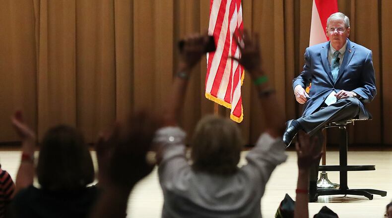 Crowdmembers stand to heckle Sen. Johnny Isakson, R - Ga., during his town hall meeting at Kennesaw State University on Monday, August 14, 2017, in Kennesaw. Curtis Compton/ccompton@ajc.com