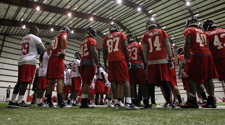Falcons rookies gather under the lights of the "barn" with the weather forcing practice indoors for rookie minicamp on Saturday, May 4, 2013, in Flowery Branch. CURTIS COMPTON / CCOMPTON@AJC.COM