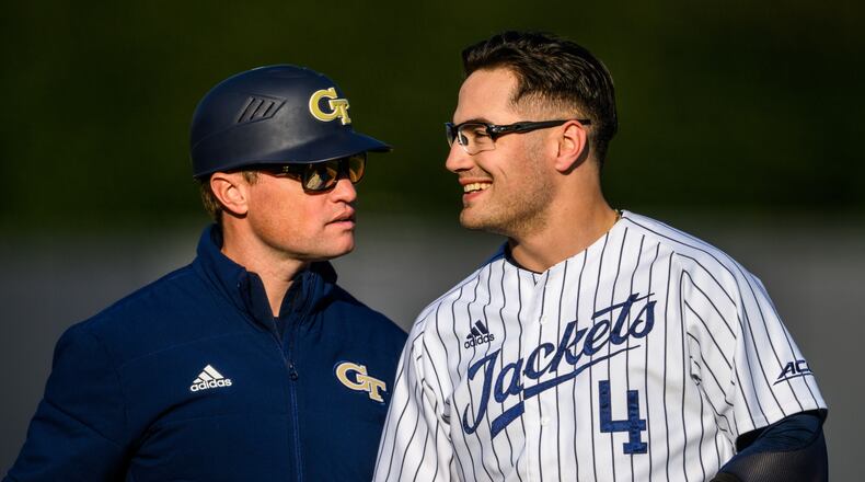 Georgia Tech assistant baseball coach James Ramsey, left, with Kevin Parada of the Yellow Jackets on Feb. 18, 2022. (Danny Karnik/Georgia Tech Athletics)