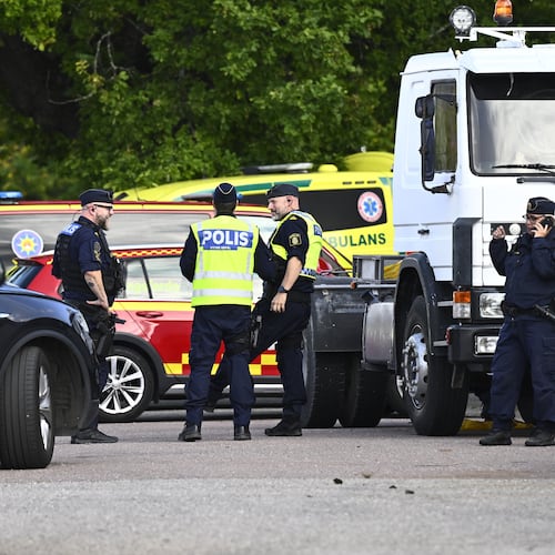 Police and emergency personnel outside Brinellskolan during a major emergency response after a man with a sword reportedly injured several people at the school in Fagersta, Sweden, Friday, Aug. 21, 2026. (Fredrik Sandberg/TT News Agency via AP)