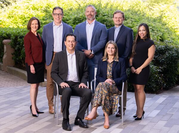 Real estate attorneys (standing left to right) Tammi Parker, Matthew Sours, Pelham Wilder, John Cagigas, Catherine Nunez, (sitting left to right) Michael Rhim and Christina Graham have left Taft | Morris Manning to open an Atlanta office of Texas law firm Winstead. (Courtesy of Winstead)