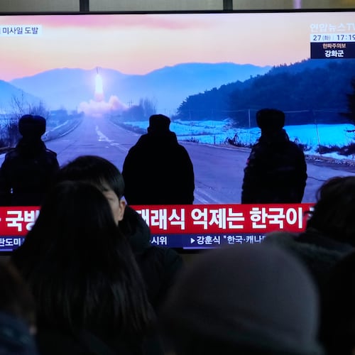 A TV screen shows a file image of North Korea's missile launch during a news program at Seoul Railway Station in Seoul, South Korea, Tuesday, Jan. 27, 2026. (AP Photo/Ahn Young-joon)