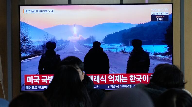 A TV screen shows a file image of North Korea's missile launch during a news program at Seoul Railway Station in Seoul, South Korea, Tuesday, Jan. 27, 2026. (AP Photo/Ahn Young-joon)