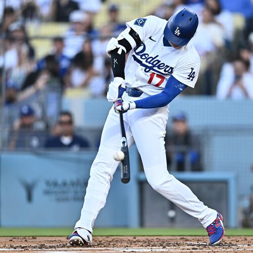 Los Angeles Dodgers' Shohei Ohtani hits a home run during the first inning of a baseball game against the Arizona Diamondbacks, Friday, July 10, 2026, in Los Angeles. (AP Photo/William Liang)