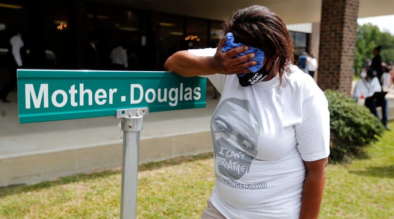 Mourners gather to pay their respects at a memorial service for George Floyd on Thursday in Minneapolis. He is being honored Saturday in North Carolina.