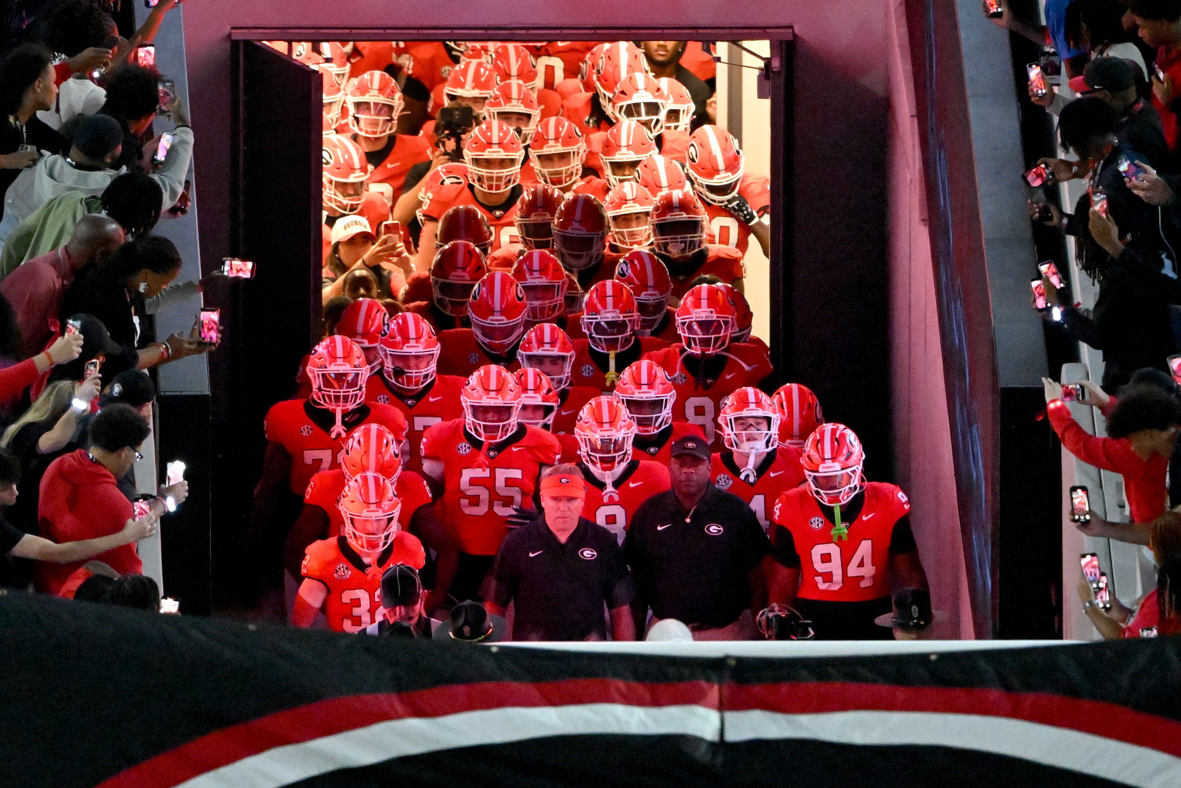Georgia head coach Kirby Smart and players run on the field before Georgia game against Alabama at Sanford Stadium, Saturday, September 27, 2025, in Athens. (Hyosub Shin / AJC)