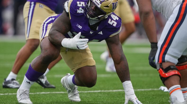 Washington defensive lineman Anterio Thompson lines up before a play against Illinois during an NCAA college football game on Saturday, Oct. 25, 2025, in Seattle. “This can’t be real,” Anterio Thompson told Kevin Stefanski when the coach called to say Thompson had been drafted by the Falcons. (Lindsey Wasson/AP 2025)