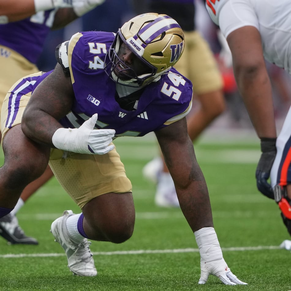Washington defensive lineman Anterio Thompson lines up before a play against Illinois during an NCAA college football game on Saturday, Oct. 25, 2025, in Seattle. “This can’t be real,” Anterio Thompson told Kevin Stefanski when the coach called to say Thompson had been drafted by the Falcons. (Lindsey Wasson/AP 2025)