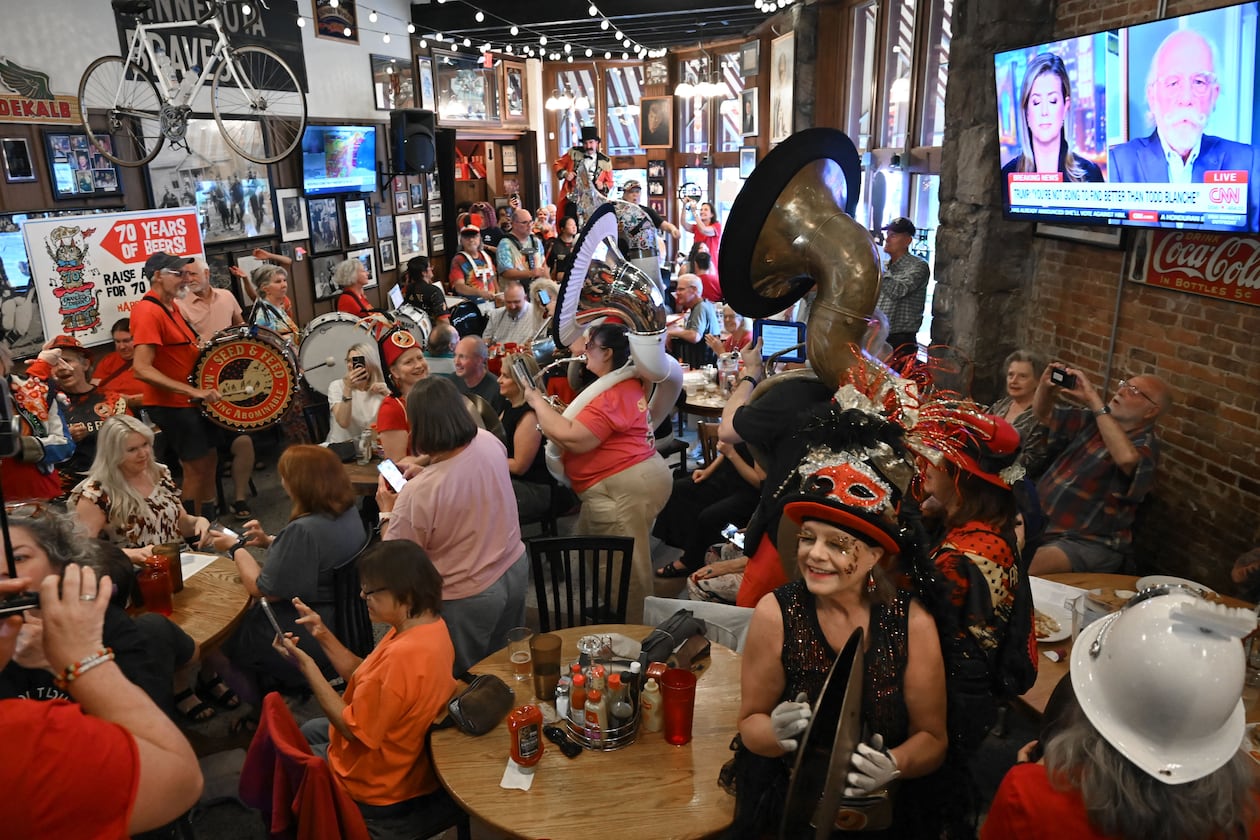 The Seed & Feed Marching Abominable performs during Manuel’s Tavern’s 70th anniversary celebration on Thursday, Aug. 6, 2026, in Atlanta. Manuel’s Tavern celebrates its 70th anniversary with a three-day festival beginning Thursday at its longtime North Highland Avenue location, featuring food specials, rare beers and live entertainment. (Hyosub Shin/AJC)