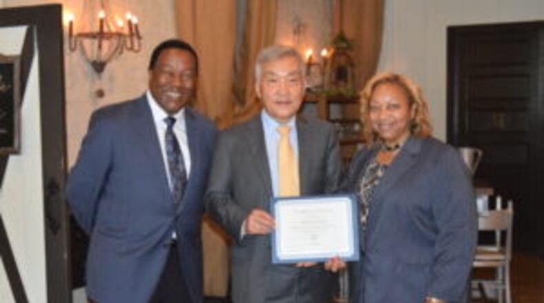 From left, Henry County Development Authority chair Pierre Clements, Zinus chairman/CEO Youn Jae Lee, and Henry County Board of Commissioners chair Carlotta Harrell.