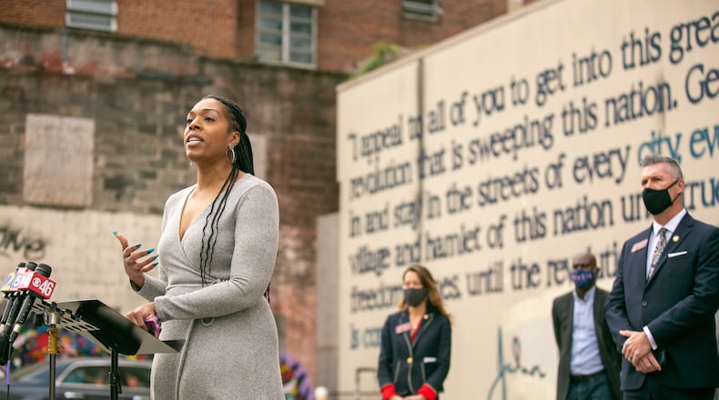 Marissa McCall Dodson, the public policy direct at the Southern Center for Human Rights, speaks at a press conference at the John Lewis mural on Auburn Avenue in downtown Atlanta on Tuesday, January 19, 2021. Democratic Georgia state lawmakers held a press conference at the John Lewis mural on Auburn Avenue to announce the introduction of two bills that would restore the right to vote to felons in Georgia. (Rebecca Wright for the Atlanta Journal-Constitution)