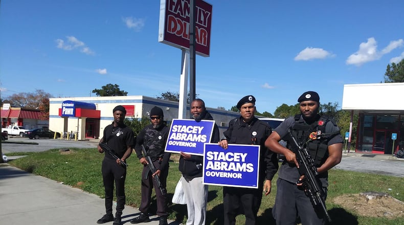 The New Black Panther Party’s Atlanta Chapter posted this picture on Nov. 3, 2018, on Facebook of members carrying weapons while campaigning for Democrat Stacey Abrams. Republican Brian Kemp shared the photos on his social media accounts the next day.
