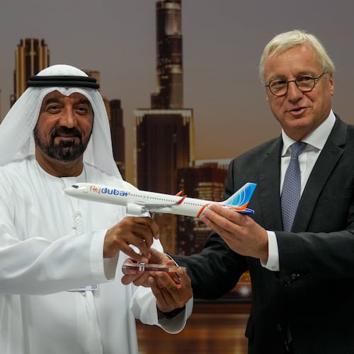 Airbus' CEO of commercial aircraft Christian Scherer presents a model of Airbus A321neo aircraft to Sheikh Ahmed bin Saeed Al Maktoum, the chairman and chief executive of Emirates and chairman of FlyDubai at a press conference to announce an order for 150 Airbus A321neo aircraft at the Dubai Air Show, United Arab Emirates, Tuesday, Nov. 18, 2025. (AP Photo/Altaf Qadri)