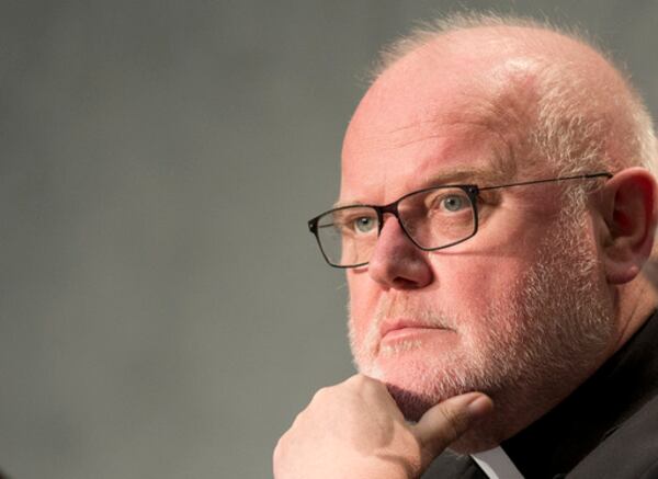 FILE - German Cardinal Reinhard Marx attends a press conference by Vatican spokesman Rev. Federico Lombardi at the Vatican's press center, Wednesday, Oct. 21, 2015. (AP Photo/Andrew Medichini, File)