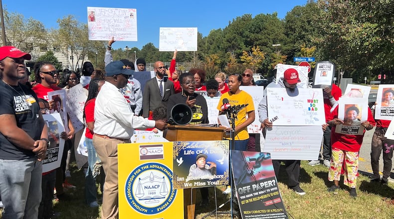 The families of the three deceased inmates and leaders from local NAACP chapters gather outside the Gwinnett County Detention Center for a press conference and protest.