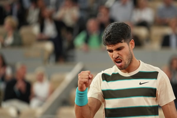 Spain's Carlos Alcaraz reacts as he plays against Italy's Lorenzo Musetti during their semifinal match of the French Tennis Open at the Roland-Garros stadium in Paris, Friday, June 6, 2025. (AP Photo/Thibault Camus)