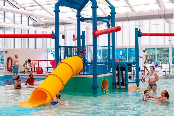 Bogan Park Aquatic Center’s indoor leisure pool in Buford has a giant water slide and water play structures. (Courtesy of Gwinnett County Parks and Recreation)