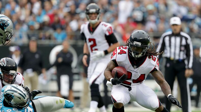 Devonta Freeman of the Atlanta Falcons runs the ball against the Carolina Panthers in the second quarter during their game at Bank of America Stadium on November 5, 2017 in Charlotte, North Carolina. (Photo by Streeter Lecka/Getty Images)