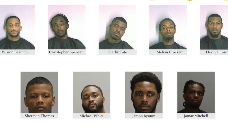 Officials released photos of nine of 12 men charged in the 2016 killing of two children on Libby Lane in Clayton County in a suspected gang retaliation attack.