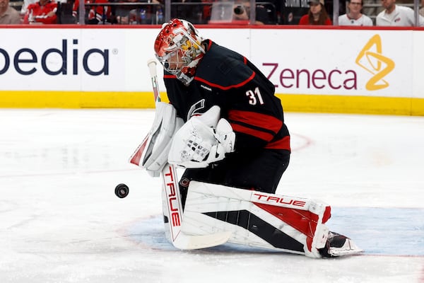 Carolina Hurricanes goaltender Frederik Andersen blocks a shot by the Washington Capitals during the first period of Game 4 of a second-round NHL hockey playoff series in Raleigh, N.C., Monday, May 12, 2025. (AP Photo/Karl DeBlaker)