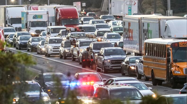 October 5, 2022 Gwinnett County: The morning commute out of the northeastern suburbs was brought to a standstill Wednesday, Oct. 5, 2022 after a multivehicle wreck spilled diesel fuel on the southbound lanes of I-85. The wreck, which involved two tractor-trailers and two other vehicles, shut down the lanes before Beaver Ruin Road at about 5:45 a.m. and was not cleared until nearly three hours later. Motorists were stuck in the backups for miles stretching back to Ga. 316. No one was injured, according to Gwinnett County police spokesperson Officer Hideshi Valle. The cause of the crash remains under investigation. The fuel spill was to blame for the lengthy closure, Valle said. Until police opened a high-occupancy toll lane at 8 a.m., southbound I-85 was a parking lot. For much of the morning, one big rig with significant front-end damage was sitting horizontal across the travel lanes after crashing into a median wall. The shutdown impacted “pretty much everybody in Gwinnett County north of Norcross,” WSB 24-hour Traffic Center reporter Mike Shields said. Even after the lanes reopened at 8:35 a.m., delays remained on I-85 for the rest of the morning drive. (John Spink / John.Spink@ajc.com)