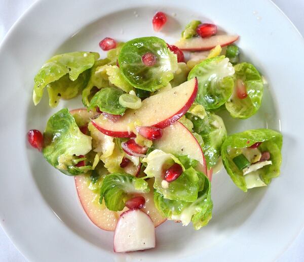 Brussels Sprouts, Apples and Pomegranate with Blue Cheese Honey Vinaigrette from North Carolina chef Vivian Howard. Styling by Wendell Brock. (Photo by Chris Hunt/Special)