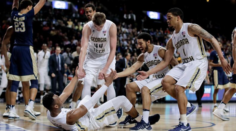 Georgia Tech guard Josh Okogie (5) is helped up by teammates after drawing a foul on a shot against Pittsburgh during the second half of an NCAA college basketball game in the first round of the ACC tournament, Tuesday, March 7, 2017, in New York. Pittsburgh won 61-59. (AP Photo/Julie Jacobson)