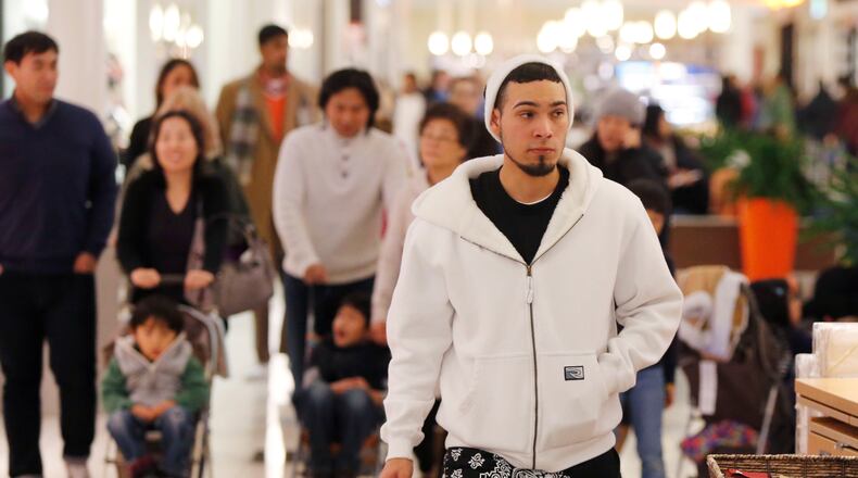 Eric Reyna was among the early shoppers at North Point Mall. The first stores at North Point Mall in Alpharetta opened at 5 p.m. Black Friday shoppers got a head start with many stores opening on Thanksgiving evening.