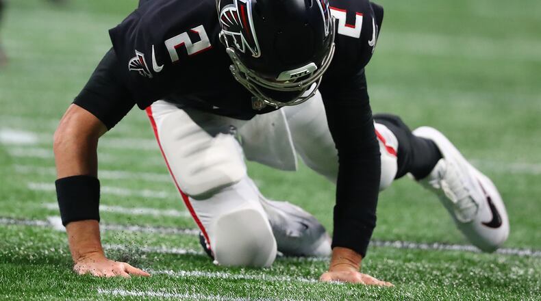 Falcons quarterback Matt Ryan is knocked to the turf by the Buccaneers during the second half during a 30-17 loss in a NFL football game on Sunday, Dec 5, 2021, in Atlanta. “Curtis Compton / Curtis.Compton@ajc.com”`