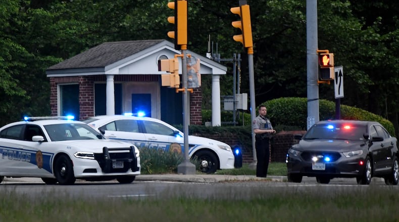Police cars are seen outside the CIA headquarters' gate Monday night after an attempted intrusion earlier in the day in Langley, Virginia. An armed person was shot by FBI agents Monday after a standoff of several hours at the entry gate to the CIA headquarters, the federal investigation agency said. headquarters outside Washington, D.C., on Monday night. The suspect was identified Tuesday morning as Roy Gordon Cole, a man who suffers from apparent mental illness and who had been previously known to CIA security, according to reports.