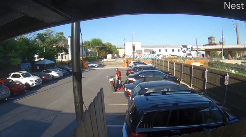 Atlanta police are searching for a suspect who smashed a woman’s car window then stole her book bag near a popular Atlanta dog park last week.