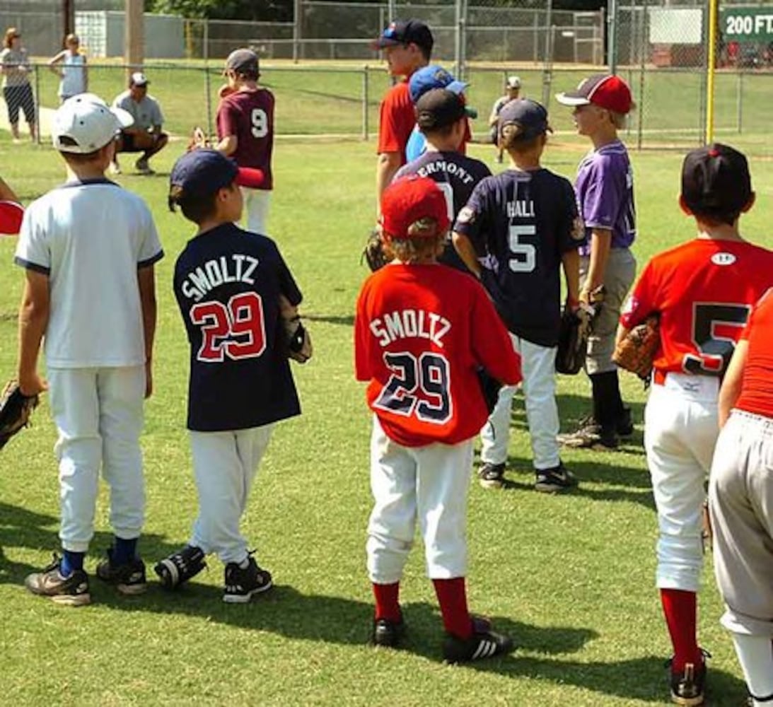 Smoltz coaches young fans at baseball camp
