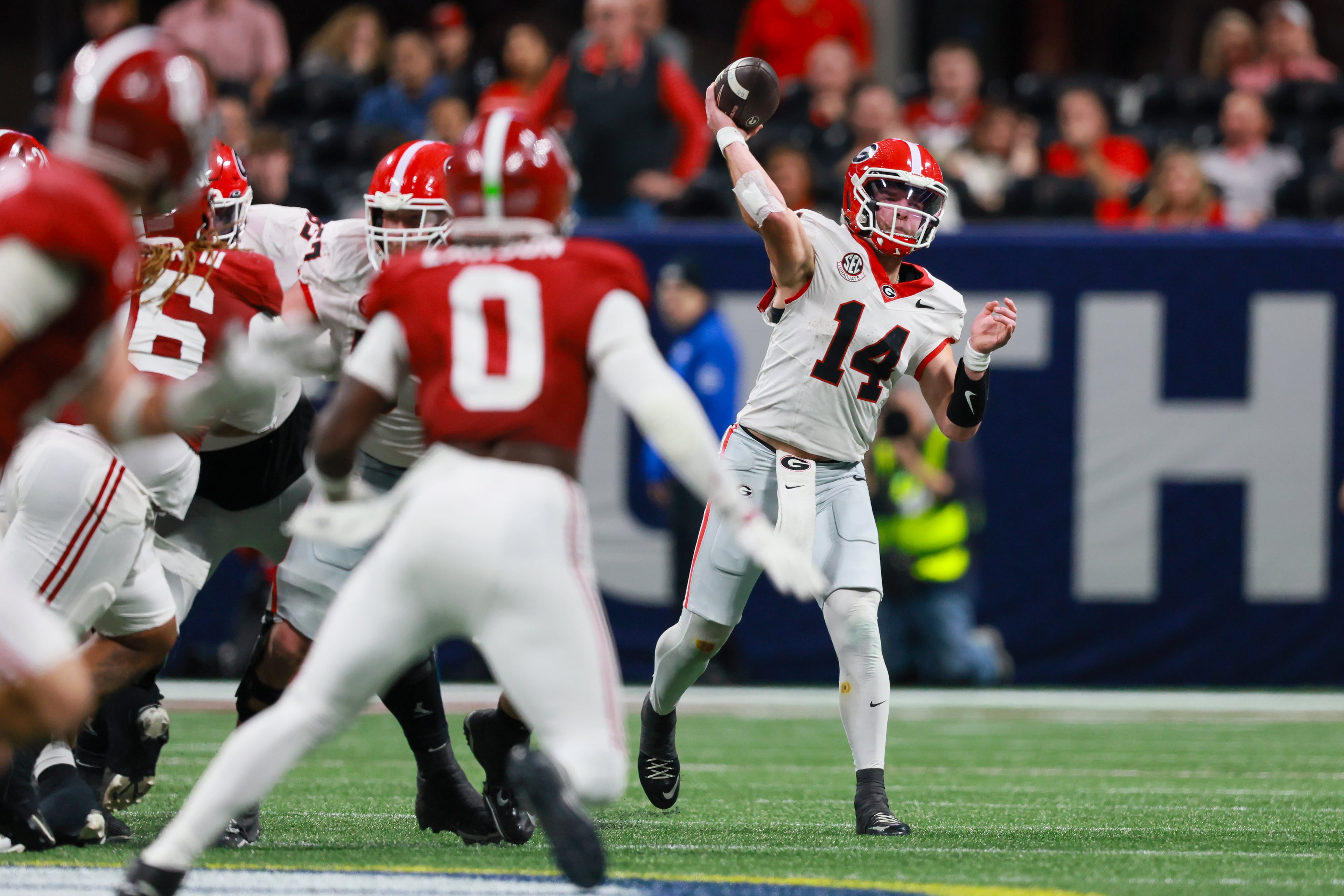 Georgia quarterback Gunner Stockton (14) throws downfield against Alabama during the fourth quarter of the SEC Championship game at Mercedes-Benz Stadium, Saturday, Dec. 6, 2025, in Atlanta. (Jason Getz / AJC)