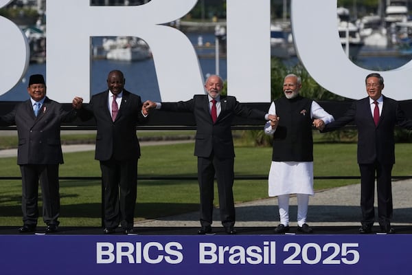 From left, Indonesia's President Prabowo Subianto, South Africa's President Cyril Ramaphosa, Brazilian President Luiz Inacio Lula da Silva, India's Prime Minister Narendra Modi, and China's Premier Li Qiang, attending the 17th annual BRICS summit pose for a group photo in Rio de Janeiro, Sunday, July 6, 2025. (AP Photo/Silvia Izquierdo)