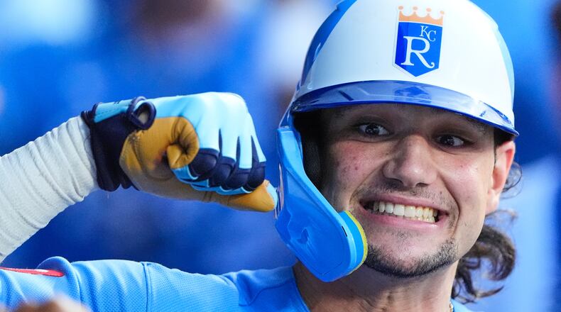Kansas City Royals' Jac Caglianone celebrates in the dugout after hitting a two-run home run during the seventh inning of a baseball game against the Chicago Cubs, Saturday, Aug. 8, 2026, in Kansas City, Mo. (AP Photo/Charlie Riedel)