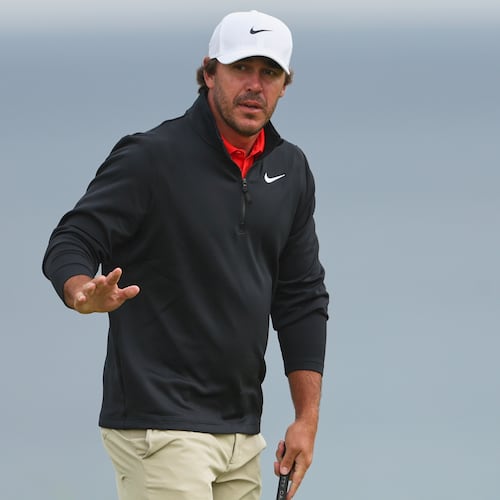 FILE - Brooks Koepka, of the United States, acknowledges the crowd on the 5th green during the first round of the British Open golf championship at the Royal Portrush Golf Club in Northern Ireland, July 17, 2025. (AP Photo/Peter Morrison, File)