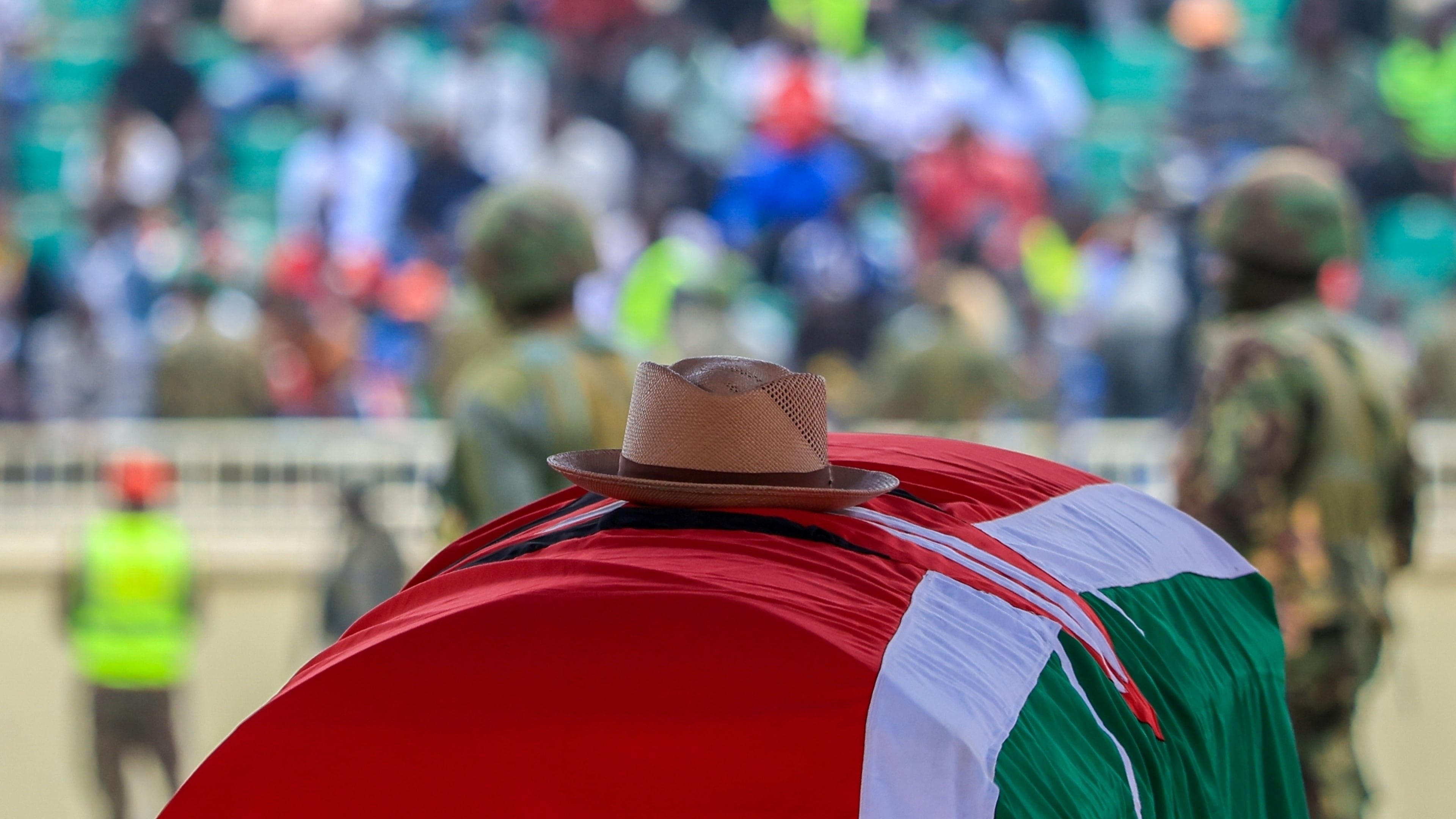 A signature cowboy hat that former Kenya Prime Minister Raila Odinga loved to wear lies on top of his coffin during his state funeral at Nyayo National Stadium in Nairobi, Kenya, Friday, Oct. 17, 2025. (AP Photo/Andrew Kasuku)
