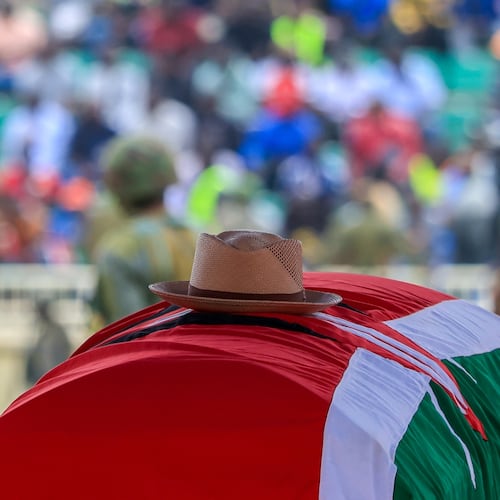 A signature cowboy hat that former Kenya Prime Minister Raila Odinga loved to wear lies on top of his coffin during his state funeral at Nyayo National Stadium in Nairobi, Kenya, Friday, Oct. 17, 2025. (AP Photo/Andrew Kasuku)