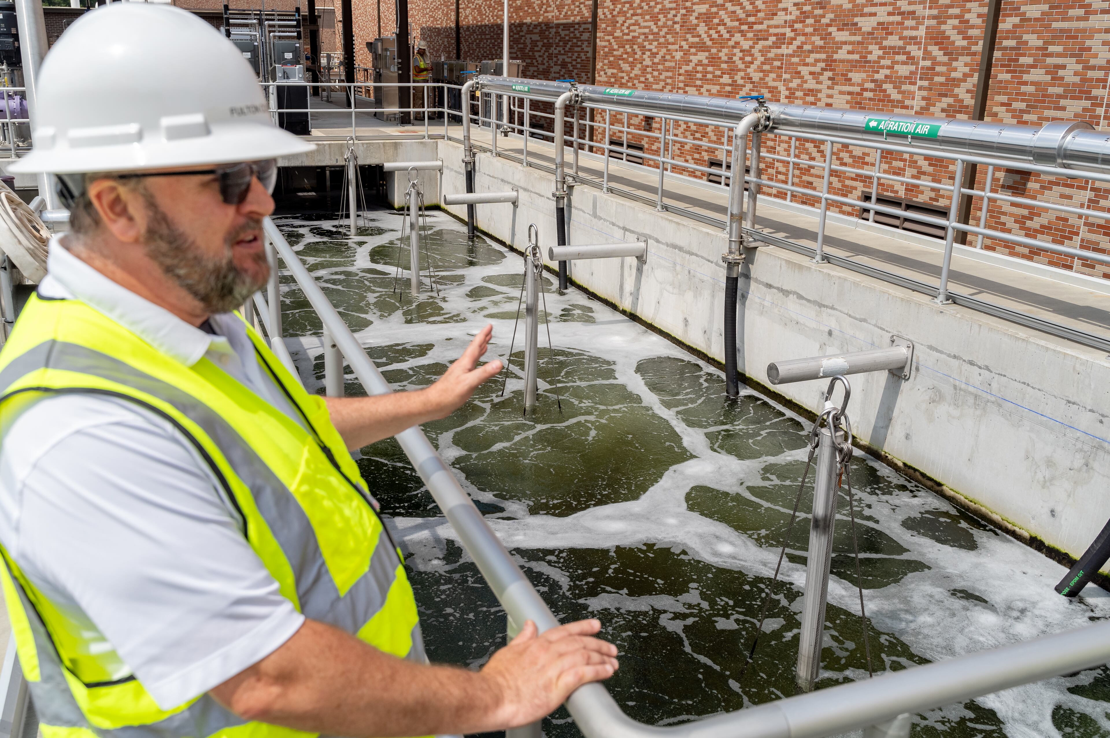 Fulton County officials tour the new water reclamation facility built on the grouds of the existing Big Creek Wastewater Treament center.
