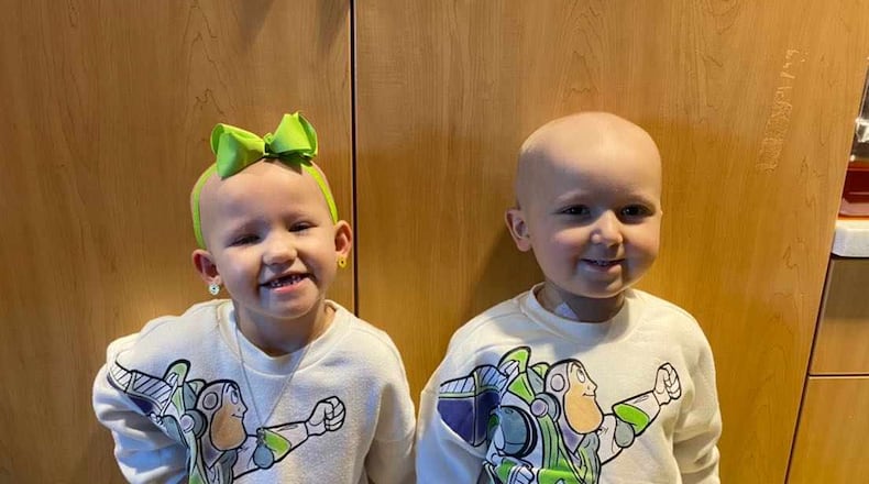 Sawyer Vines and Levi Lansdell, both age 3 in this photo taken in February, at Children's Healthcare of Atlanta Hospital. The two became best friends, and their parents also formed a close friendship, during their long hospital stay for cancer treatments. Both children are now out of the hospital and their cancer is in remission. Photo courtesy of CURE Childhood Cancer