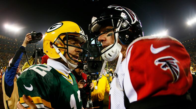 Green Bay's Aaron Rodgers and the Falcons Matt Ryan are pretty much head-to-head in late-season performance. (Kevin C. Cox/Getty Images)
