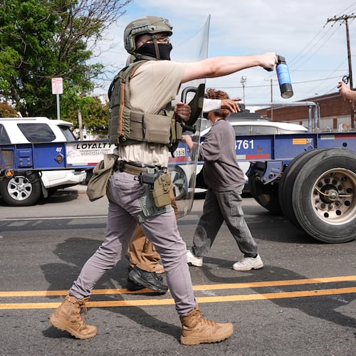 Federal immigration officers confront protesters outside the Delaney Hall detention center Thursday, May 28, 2026, in Newark, N.J. (AP Photo/Angelina Katsanis)